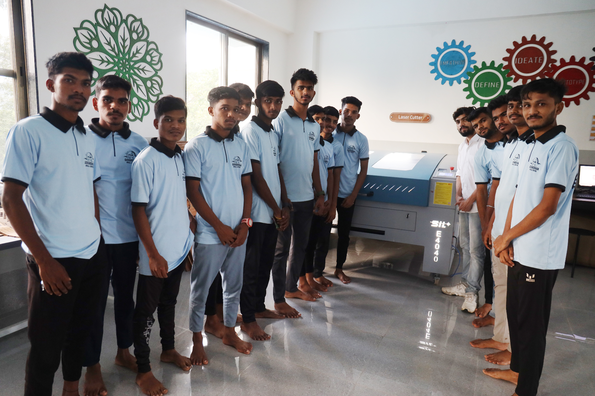 Trainees at the GSC laser-cutter lab