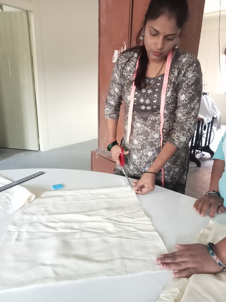 Young woman training in tailoring at GSC
