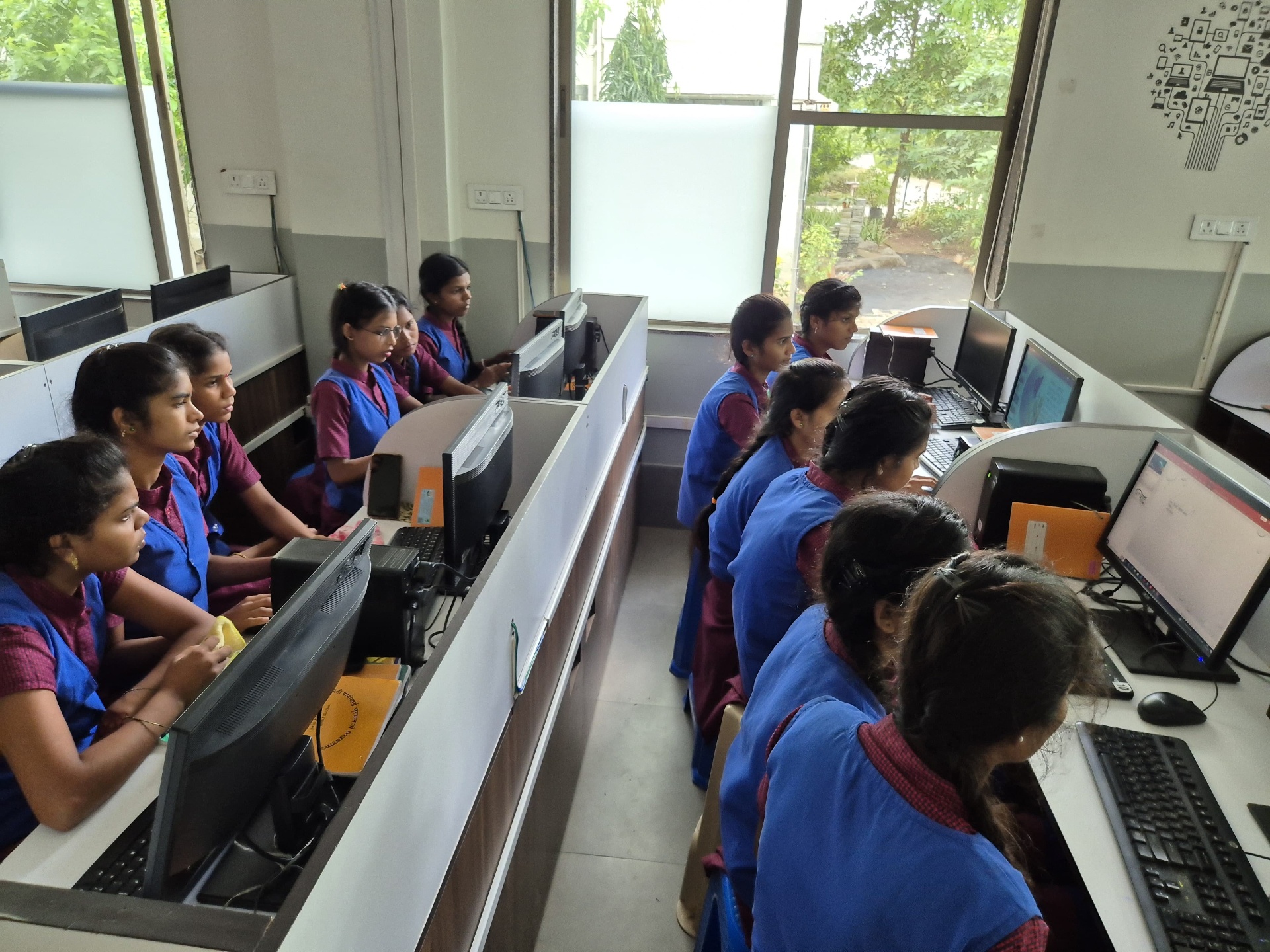 Girls learning at the Govardhan Skill Centre computer lab